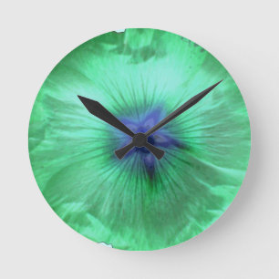 Hollyhock Flower Glowing Green Wall Clock