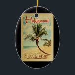 Hollywood Palm Tree Vintage Travel Ceramic Ornament<br><div class="desc">A uniquely retro mid-century modern Hollywood Florida art print in vintage travel poster style. It features a curved palm tree on sandy beach with ocean under a blue cloudy sky.</div>