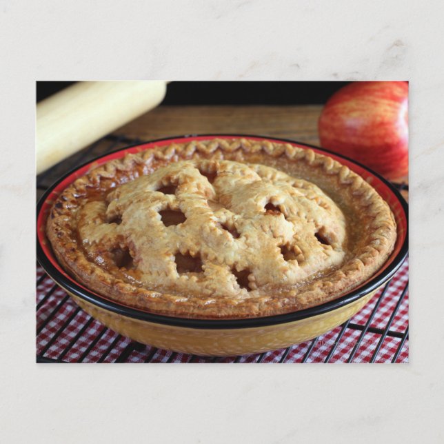 Home baked apple pie on cooling rack with apple postcard (Front)