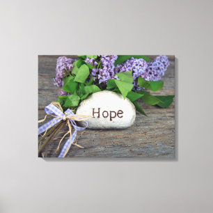 Hope text on rock with lilacs canvas print