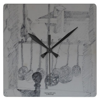 Horloge carré avec cuisines et ustensiles.