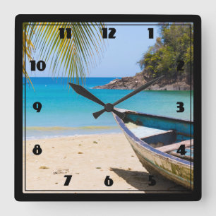 Horloge Carrée Belle plage tropicale avec bateau à rames