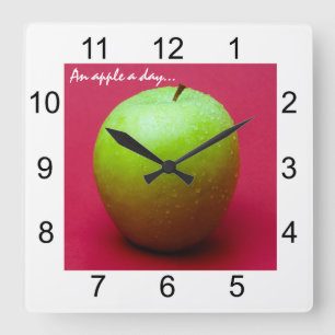 Horloge Carrée Green apple on red background