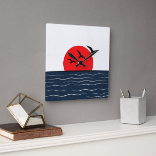 Horloge Carrée Mouettes sur Soleil Rouge avec Océan