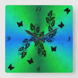 Horloge Carrée Papillon noir sur arc-en-ciel bleu vert
