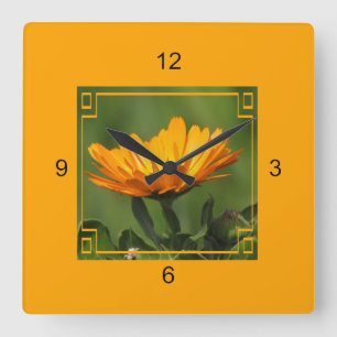 Horloge - Fleur orange dans le cadre