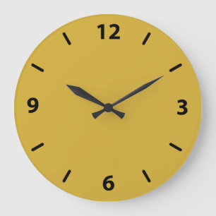 Horloge murale en or avec chiffres noirs