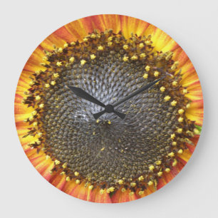 Horloge murale rouge et jaune de tournesol
