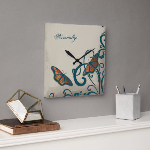 Horloge murale turquoise à rotation papillon