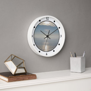 Horloge - Réflexions du soleil sur l'océan