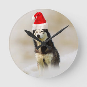 Horloge Ronde Chien sibérien Husky avec chapeau de Santa Hat en