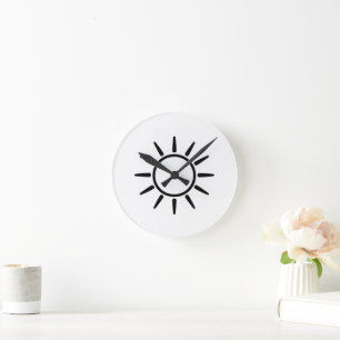 Horloge Ronde Coussin jet symbole de soleil minimaliste