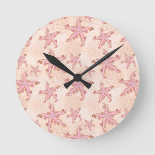 Horloge Ronde Étoiles de mer et motif pastel rose corail