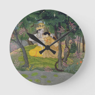 Horloge Ronde Étreinte de Radha et de Krishna dans un verger de