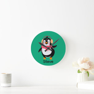 Horloge Ronde Manchot joyeux de Noël avec écharpe et cache-oreil
