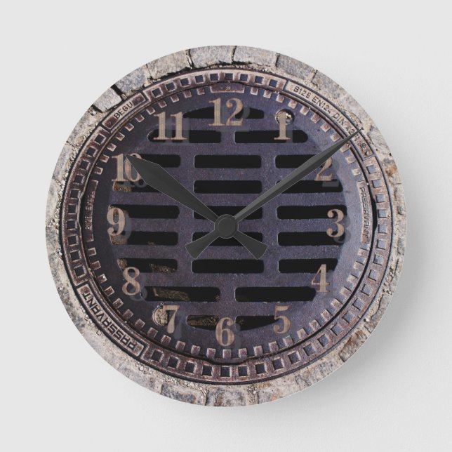 Horloge Ronde Manhole cover and cobblestone road clock (Recto)