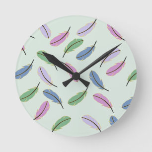 Horloge Ronde Motif de plumes pastel élégant