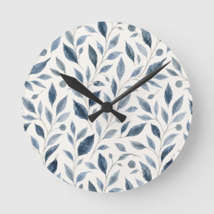 Horloge Ronde Motif élégant de feuilles à l'aquarelle bleue
