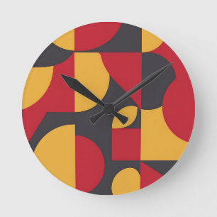 Horloge Ronde Motif géométrique gras rouge jaune gris du milieu 