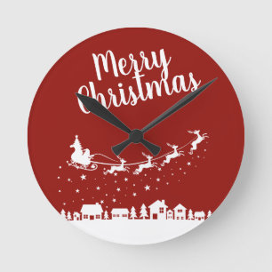 Horloge Ronde Père Noël silhouette de traîneau volant au-dessus 