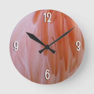 Horloge Ronde Plumes de Flamant rose dans les tons roses