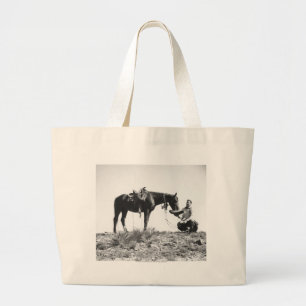 Horse eating from a cowboy's hat. large tote bag
