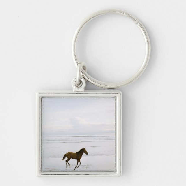 Horse running on the beach keychain (Front)