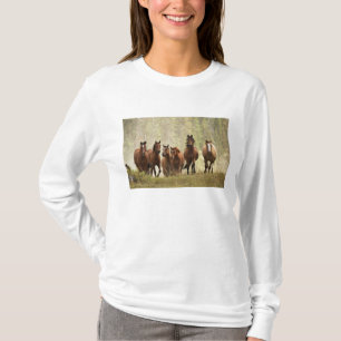 Horses cresting small hill during roundup T-Shirt