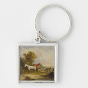Horses Grazing: A Grey Stallion grazing with Mares Keychain