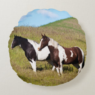 Horses on the hillside round pillow