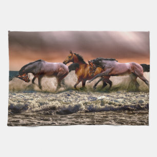 Horses Running in Ocean Surf at Sunset Kitchen Towel