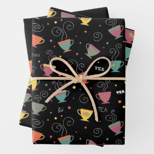 Hot cup of tea, colorful coffee mugs steaming wrapping paper sheet
