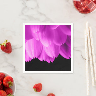 Hot pink flower petals on black napkin