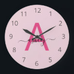 Hot Pink Modern Script Girly Monogram Name Large Clock<br><div class="desc">A striking blend of style and functionality, this personalized clock features a bold, hot pink monogram set against a soft pink background, showcasing an elegant, handwritten script for the name. The minimalist design balances vibrant modernity with a touch of femininity, making it a standout piece for any room that calls...</div>