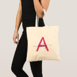 Hot Pink Modern Script Girly Monogram Name Tote Bag<br><div class="desc">The perfect blend of style and practicality, this personalized tote bag features a striking hot pink monogram set against a soft blush background. Ideal for the discerning individual who values both form and function, this bag is as versatile as it is chic. Whether you're heading to the market, the gym,...</div>