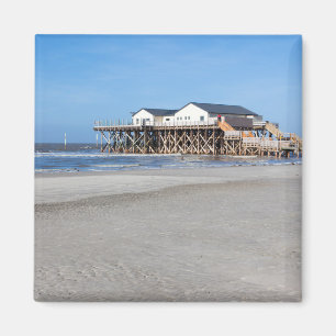 House on stilts at the beach of St. Peter Ording Magnet