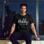 Hubby White Script "EST 202X" - Modern Groomsmen  T-Shirt<br><div class="desc">Celebrate the groom-to-be with this stylish and personalized "Hubby Est. 202X" groomsmen bachelor party shirt. This black t-shirt features a modern and elegant design, making it a must-have for any pre-wedding celebration. Crafted from high-quality, comfortable fabric, it's perfect for a night out with the groomsmen or a casual daytime event....</div>