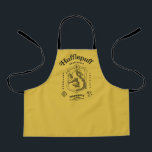 HUFFLEPUFF™ Dedication Patience Loyalty Crest Apron<br><div class="desc">Celebrate loyalty, patience, and unwavering dedication with this bold Hufflepuff™ crest design. Featuring the proud badger set within a classic shield, this striking artwork highlights the house’s defining traits — Dedication, Patience, and Loyalty — in a timeless, vintage-inspired layout. Rendered in signature house colors with detailed linework and subtle magical...</div>