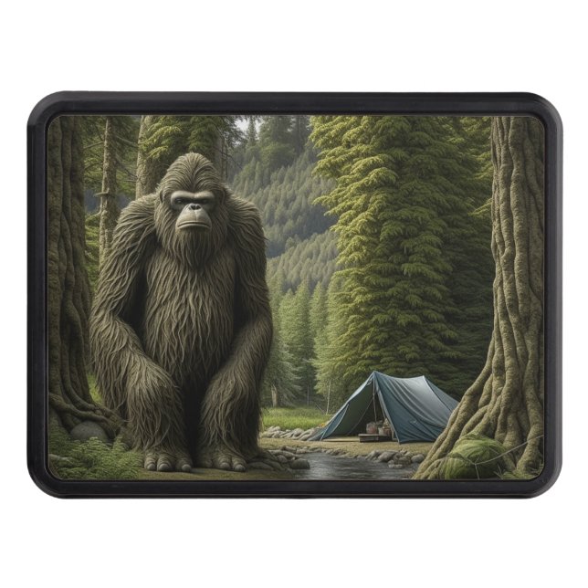 Huge Bigfoot sitting next to Tent in the Woods Trailer Hitch Cover (Front)