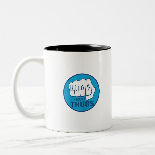 HUGS NOT THUGS Two-Tone COFFEE MUG (Left)