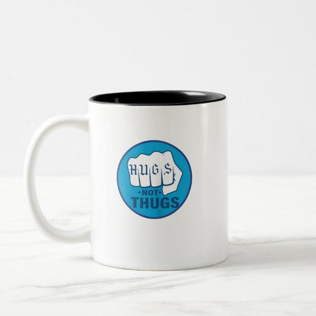 HUGS NOT THUGS Two-Tone COFFEE MUG (Left)