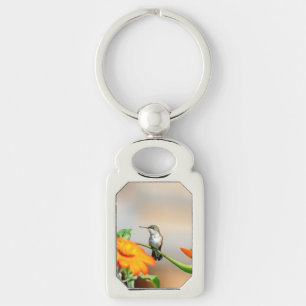 Hummingbird on a flowering plant keychain
