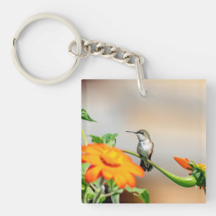 Hummingbird on a flowering plant keychain