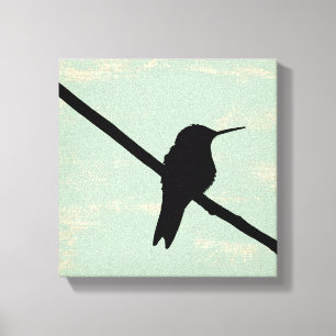 Hummingbird Silhouette on Blue Grunge Background Canvas Print