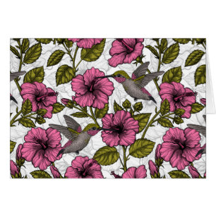 Hummingbirds and pink hibiscus flowers