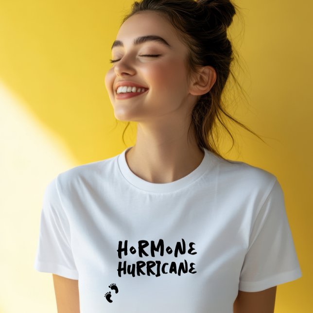Humorous pregnancy baby fingerprint black T-Shirt (Accompanying this striking visual is the lighthearted and amusing phrase "Hormone Hurricane,")