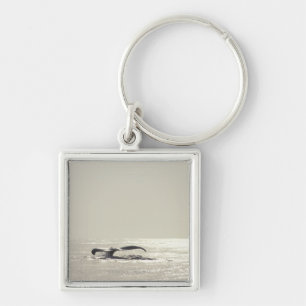 Humpback whale, tail over water surface keychain