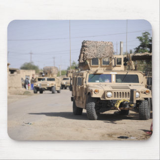 Humvee's conduct security during a patrol mouse pad
