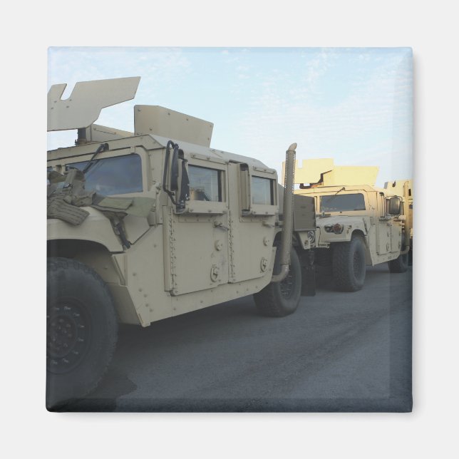 Humvees sit on the pier at Morehead City Magnet (Front)