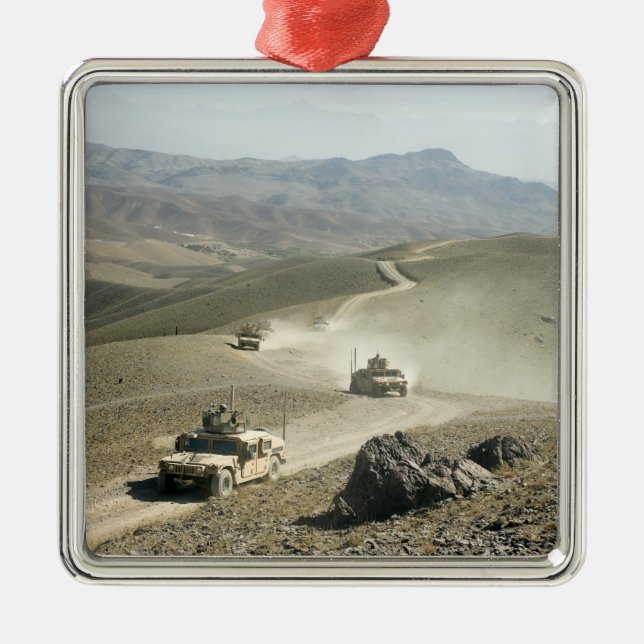Humvees traverse rugged mountain roads metal ornament (Front)